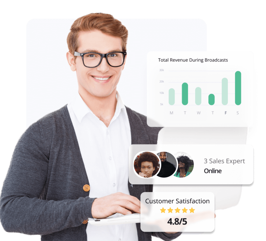 A man holds a computer smiling and data graphs on screen