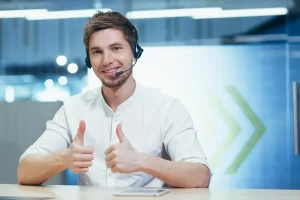 A happy male call center employee